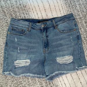 Never worn boutique, distressed jeans short. Stretchy material!
